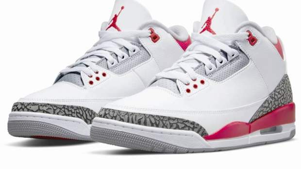View of white and red Air Jordan sneakers.